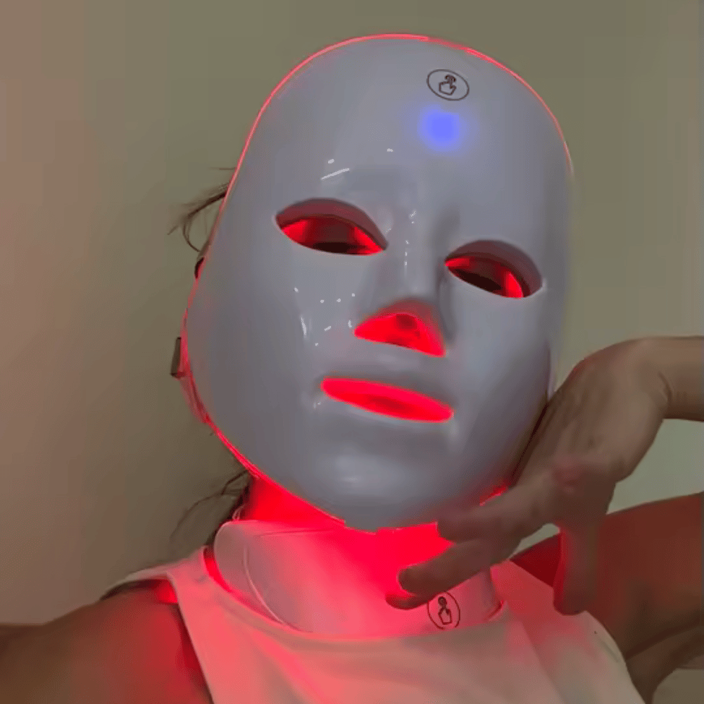 Customer wearing LED facial mask with red light turned on.