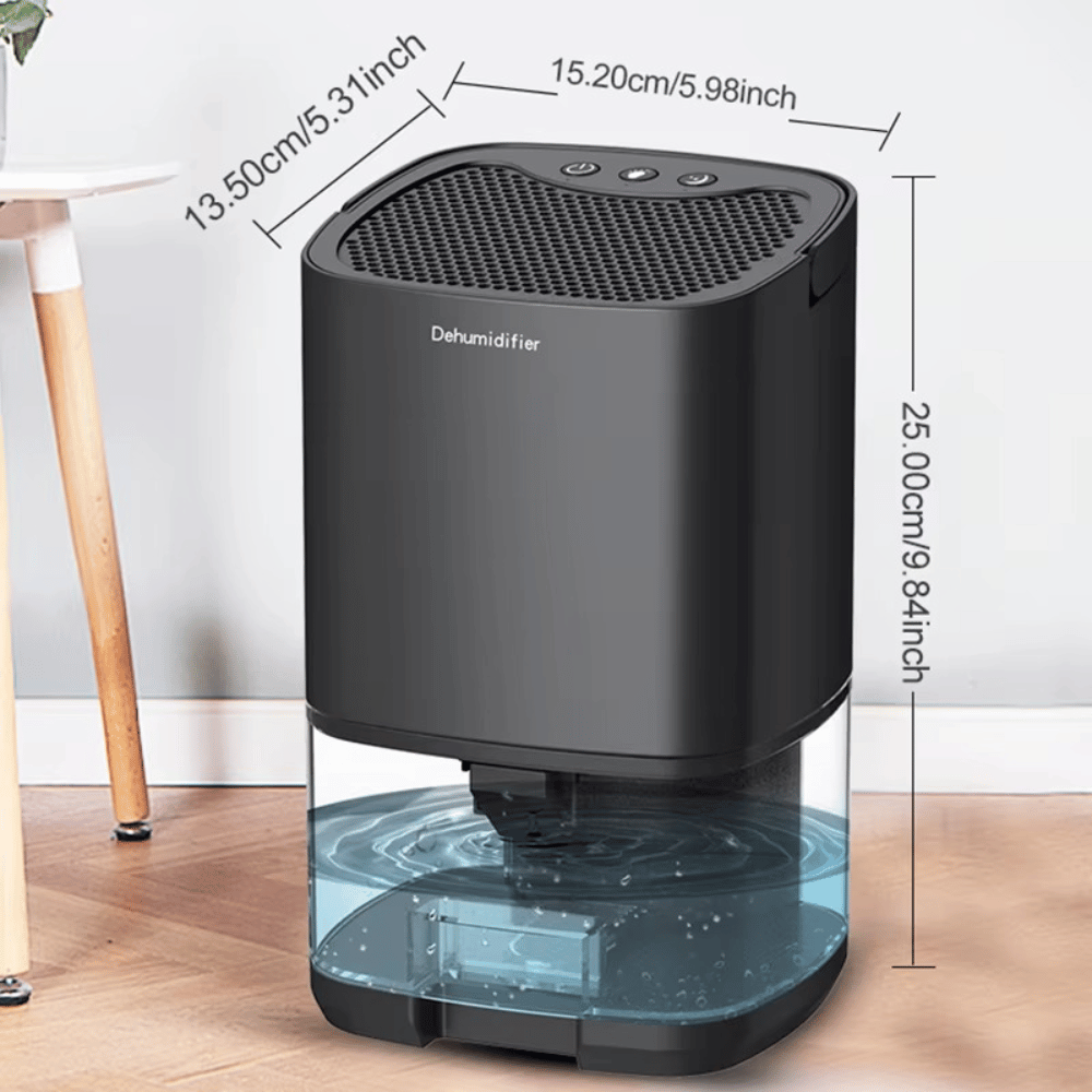Black dehumidifier with dimensions labeled on a wooden floor.