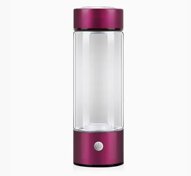 Purple glass water bottle with a clear body on a white background