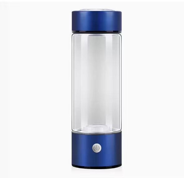 Clear glass bottle with blue metal cap and base on a white background