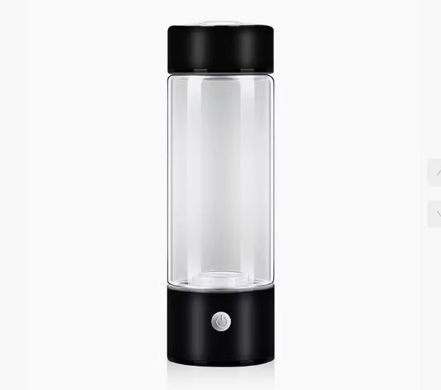 Clear glass bottle with black lid and base on a white background