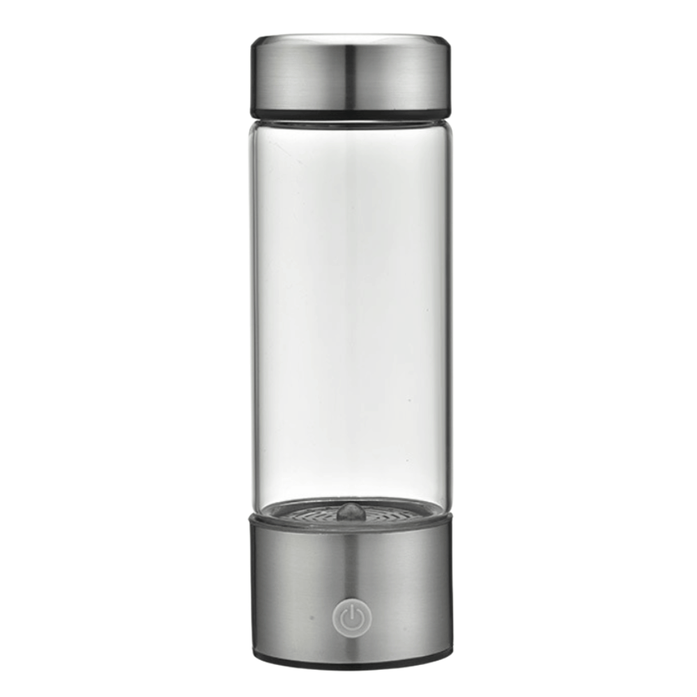 Clear glass bottle with silver metal cap and base on a white background